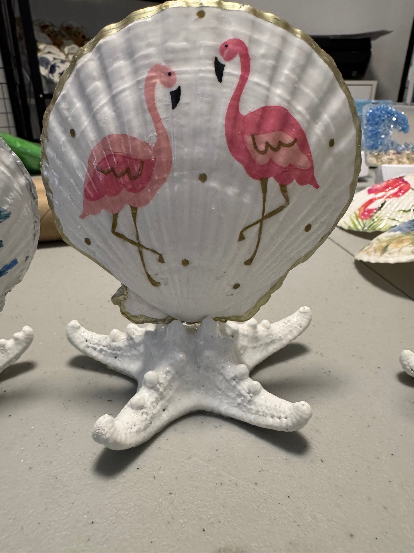 2 flamingos on seastar